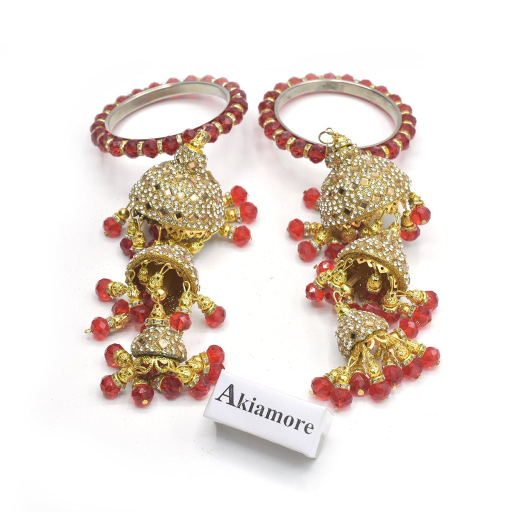 Pink studded meenakari latkan jhumka by Panigh | The Secret Label